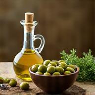 Bowl of olives and a bottle of olive oil